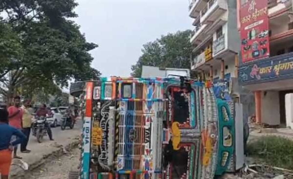 Truck became unbalanced and overturned near Maldepur turn, driver injured