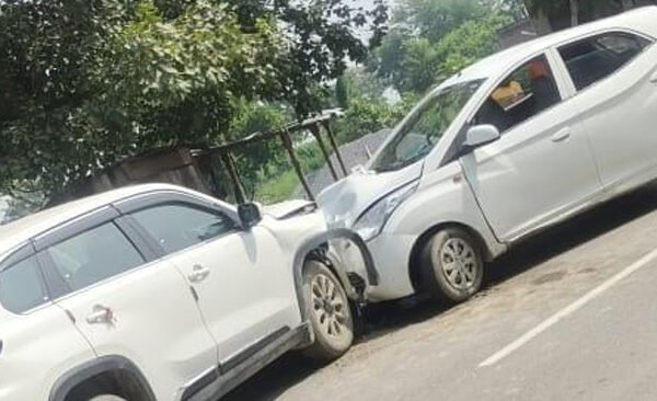Car collides with parked car, driver injured